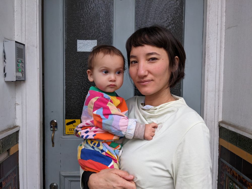 Elvira Grob and her 10-month-old daughter, Yoomi. Elvira has been forced to take on extra work to make ends meet.